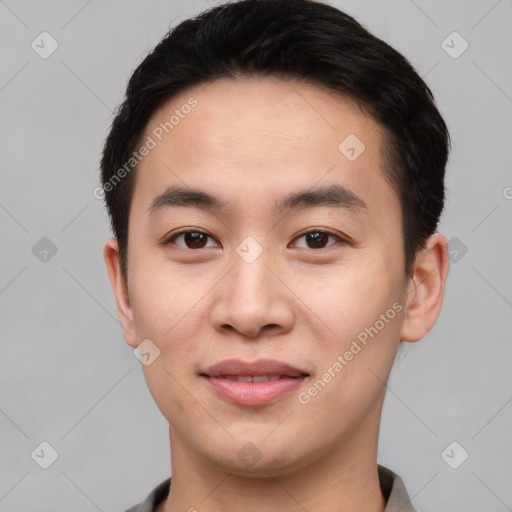 Joyful asian young-adult male with short  black hair and brown eyes