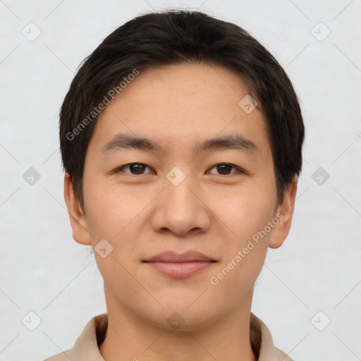 Joyful asian young-adult male with short  brown hair and brown eyes