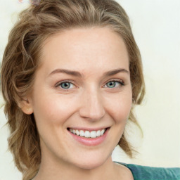 Joyful white young-adult female with medium  brown hair and green eyes