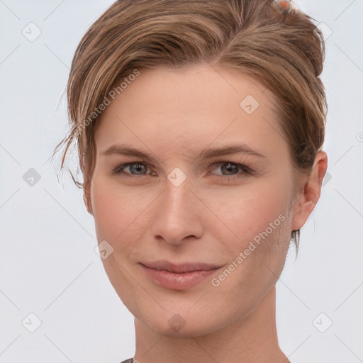 Joyful white young-adult female with short  brown hair and grey eyes