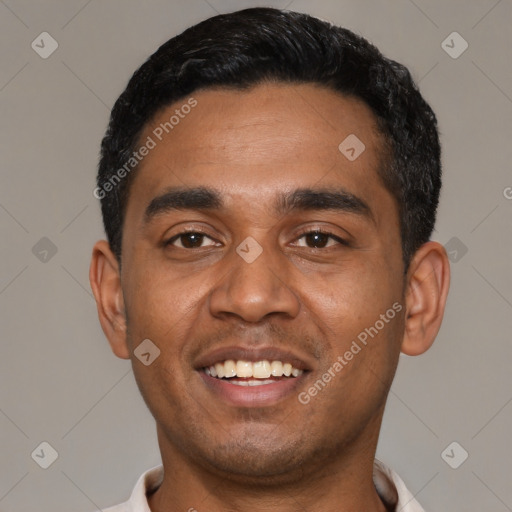 Joyful black young-adult male with short  black hair and brown eyes