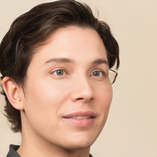 Joyful white young-adult male with medium  brown hair and grey eyes