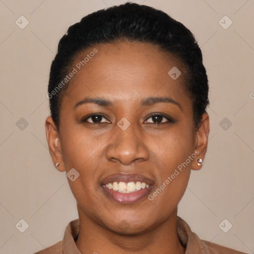 Joyful black young-adult female with short  black hair and brown eyes