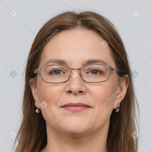 Joyful white adult female with long  brown hair and grey eyes