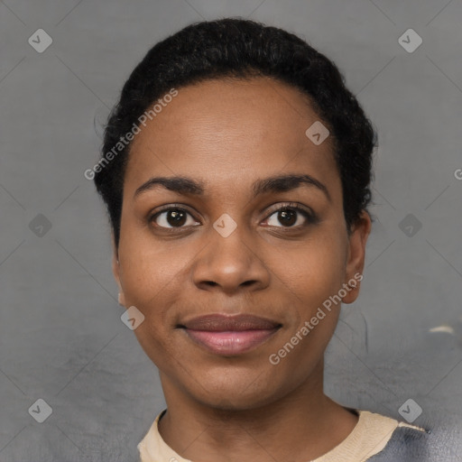 Joyful black young-adult female with short  black hair and brown eyes