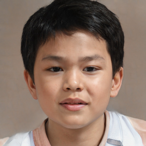 Joyful asian child male with short  brown hair and brown eyes