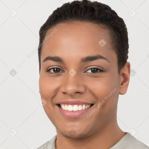 Joyful latino young-adult female with short  brown hair and brown eyes