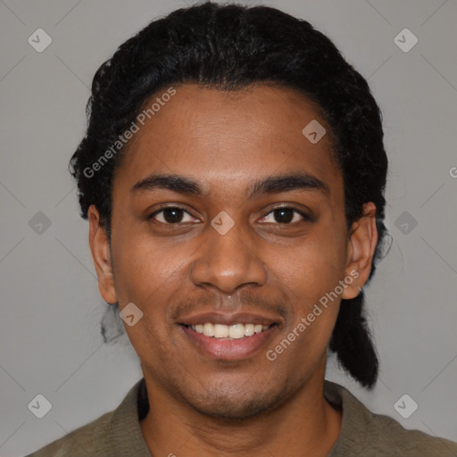 Joyful black young-adult male with short  black hair and brown eyes