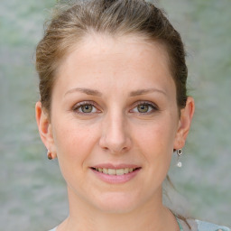 Joyful white adult female with short  brown hair and grey eyes