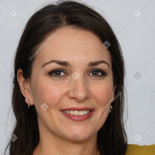 Joyful white adult female with long  brown hair and brown eyes