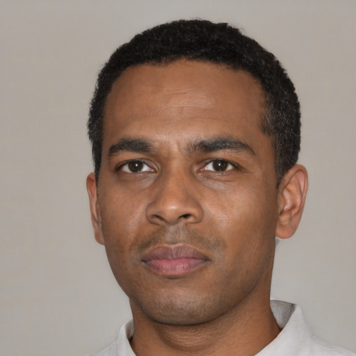 Neutral black young-adult male with short  black hair and brown eyes