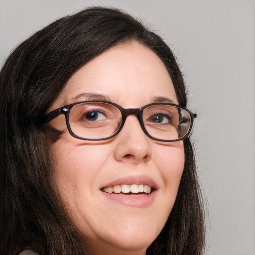 Joyful white adult female with long  brown hair and brown eyes