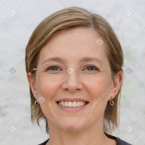 Joyful white adult female with medium  brown hair and grey eyes