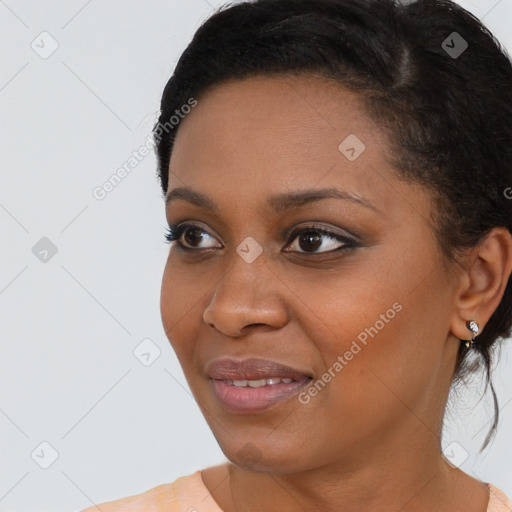 Joyful black young-adult female with medium  brown hair and brown eyes