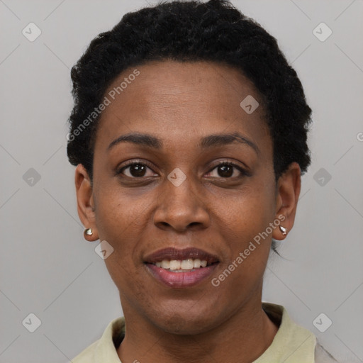 Joyful black young-adult female with short  black hair and brown eyes