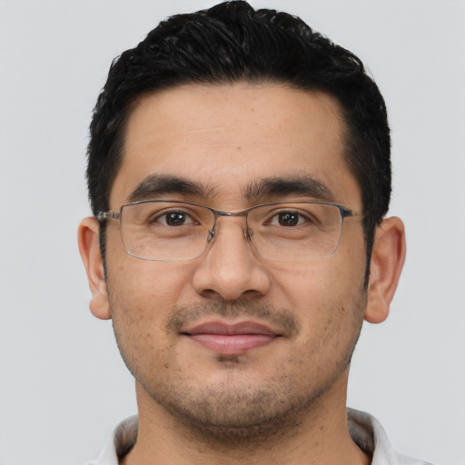 Joyful asian young-adult male with short  black hair and brown eyes