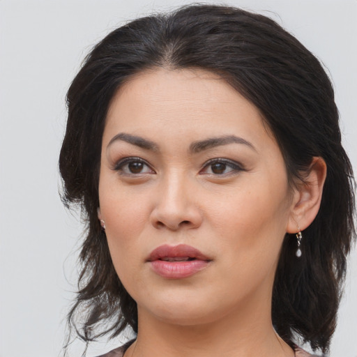 Joyful asian young-adult female with medium  brown hair and brown eyes