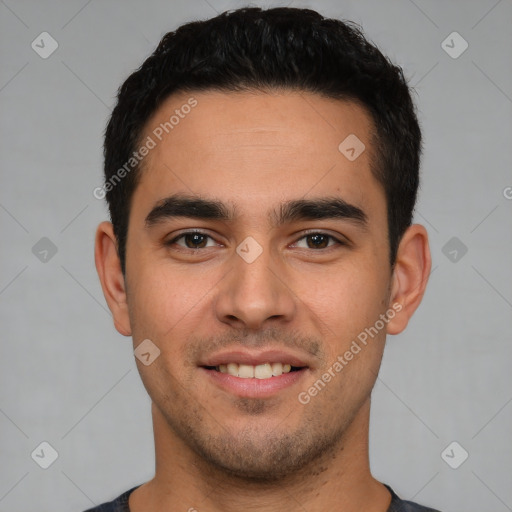 Joyful white young-adult male with short  black hair and brown eyes