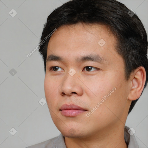 Neutral asian young-adult male with short  black hair and brown eyes