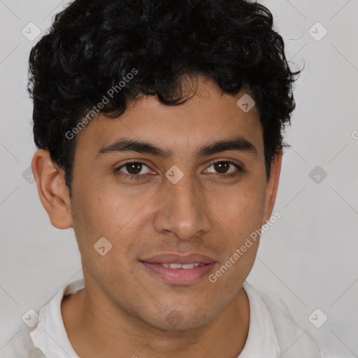 Joyful latino young-adult male with short  brown hair and brown eyes