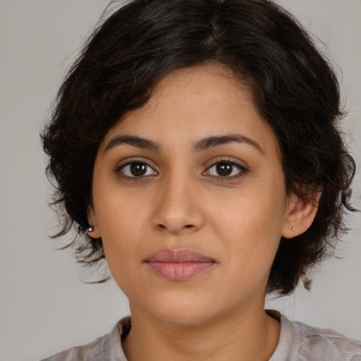 Joyful white young-adult female with medium  brown hair and brown eyes