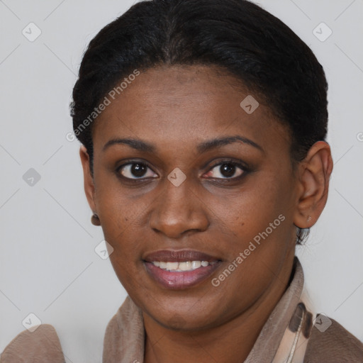 Joyful black young-adult female with short  brown hair and brown eyes