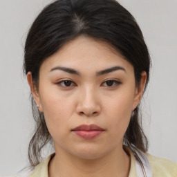 Neutral asian young-adult female with medium  brown hair and brown eyes