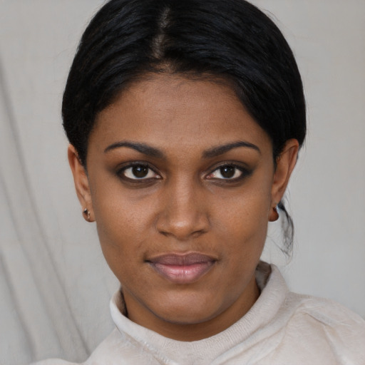 Joyful asian young-adult female with short  black hair and brown eyes