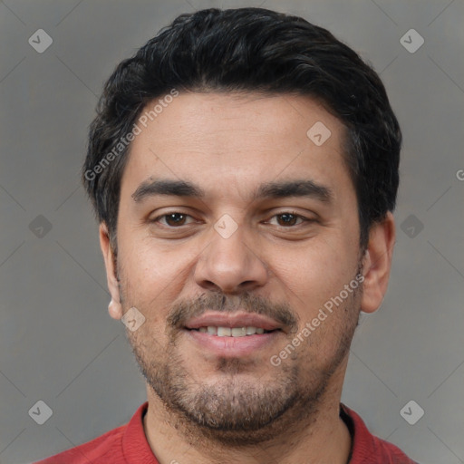 Joyful latino young-adult male with short  black hair and brown eyes