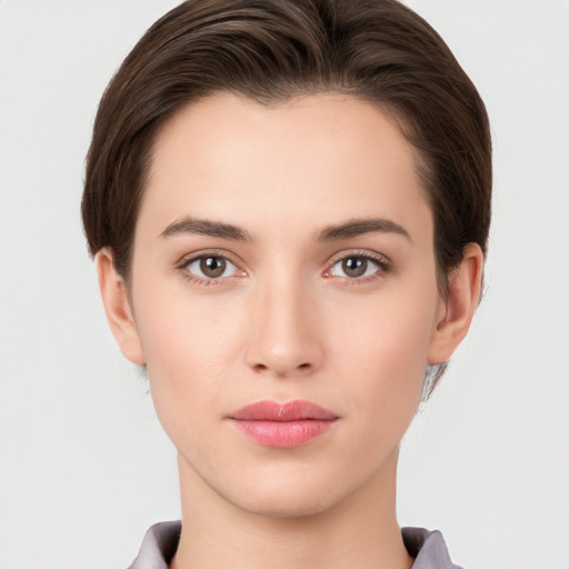 Neutral white young-adult female with short  brown hair and brown eyes