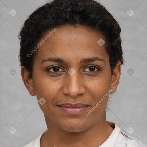 Joyful black young-adult female with short  brown hair and brown eyes