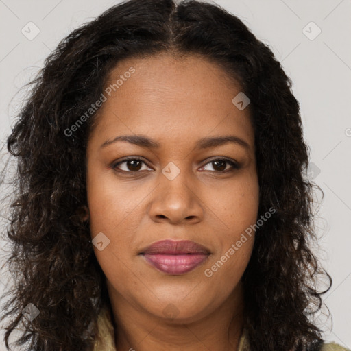 Joyful black young-adult female with long  brown hair and brown eyes