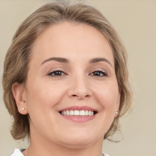 Joyful white young-adult female with medium  brown hair and brown eyes