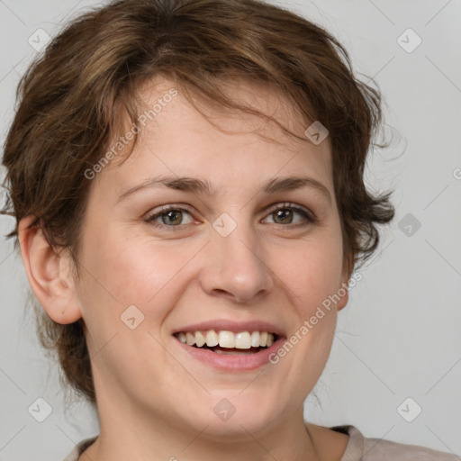 Joyful white young-adult female with medium  brown hair and green eyes