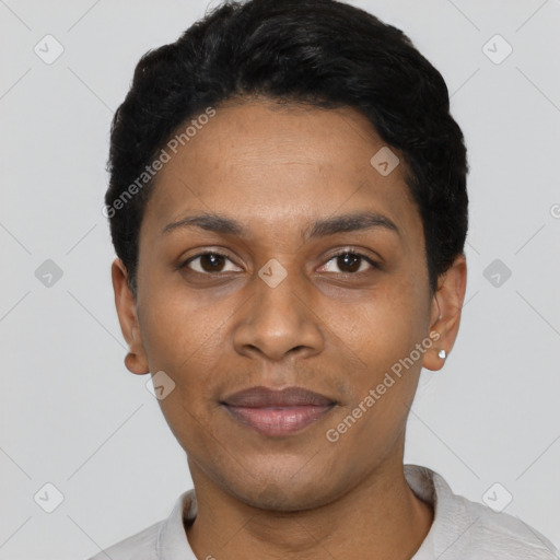 Joyful black young-adult female with short  black hair and brown eyes