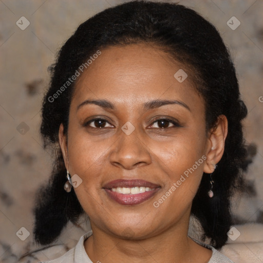 Joyful latino adult female with medium  brown hair and brown eyes