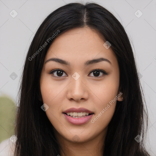 Joyful asian young-adult female with long  brown hair and brown eyes