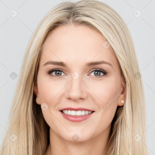 Joyful white young-adult female with long  brown hair and blue eyes