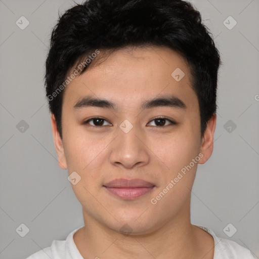 Joyful asian young-adult male with short  black hair and brown eyes