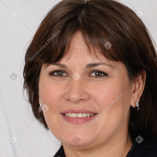 Joyful white adult female with medium  brown hair and grey eyes