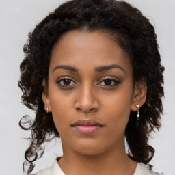 Neutral black young-adult female with long  brown hair and brown eyes