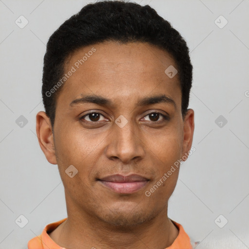 Joyful black young-adult male with short  brown hair and brown eyes