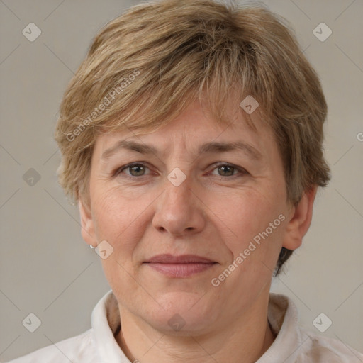 Joyful white adult female with short  brown hair and brown eyes