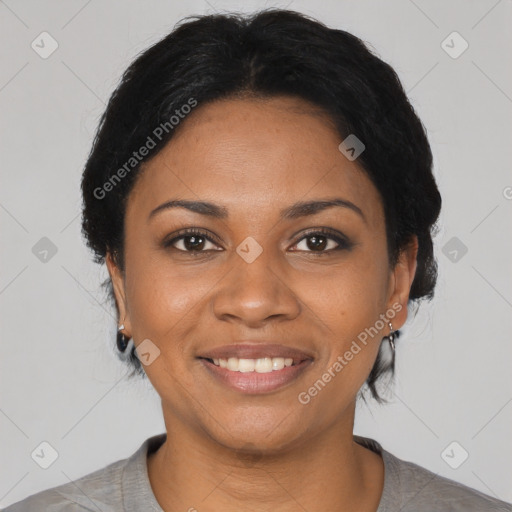 Joyful black young-adult female with short  black hair and brown eyes