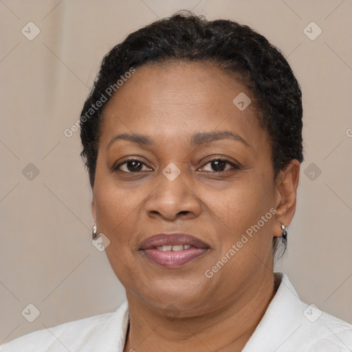 Joyful black adult female with short  brown hair and brown eyes