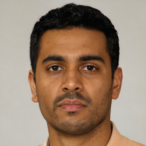 Neutral latino young-adult male with short  black hair and brown eyes