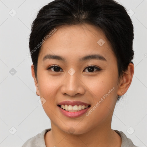 Joyful asian young-adult female with short  brown hair and brown eyes