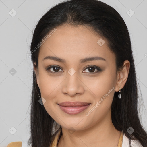 Joyful latino young-adult female with long  brown hair and brown eyes