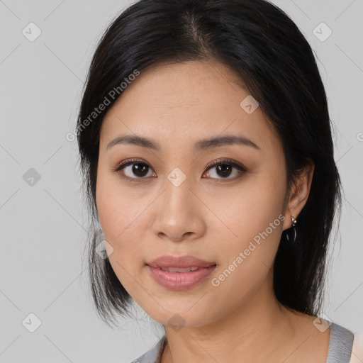 Joyful asian young-adult female with medium  black hair and brown eyes