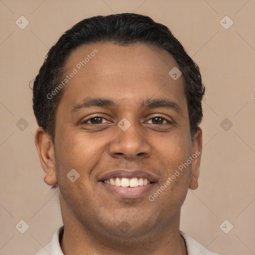 Joyful latino young-adult male with short  brown hair and brown eyes